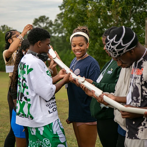 Group of kids in team building at a CTI conference