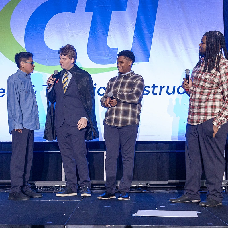 Kids at a CTI Conference in team building exercise